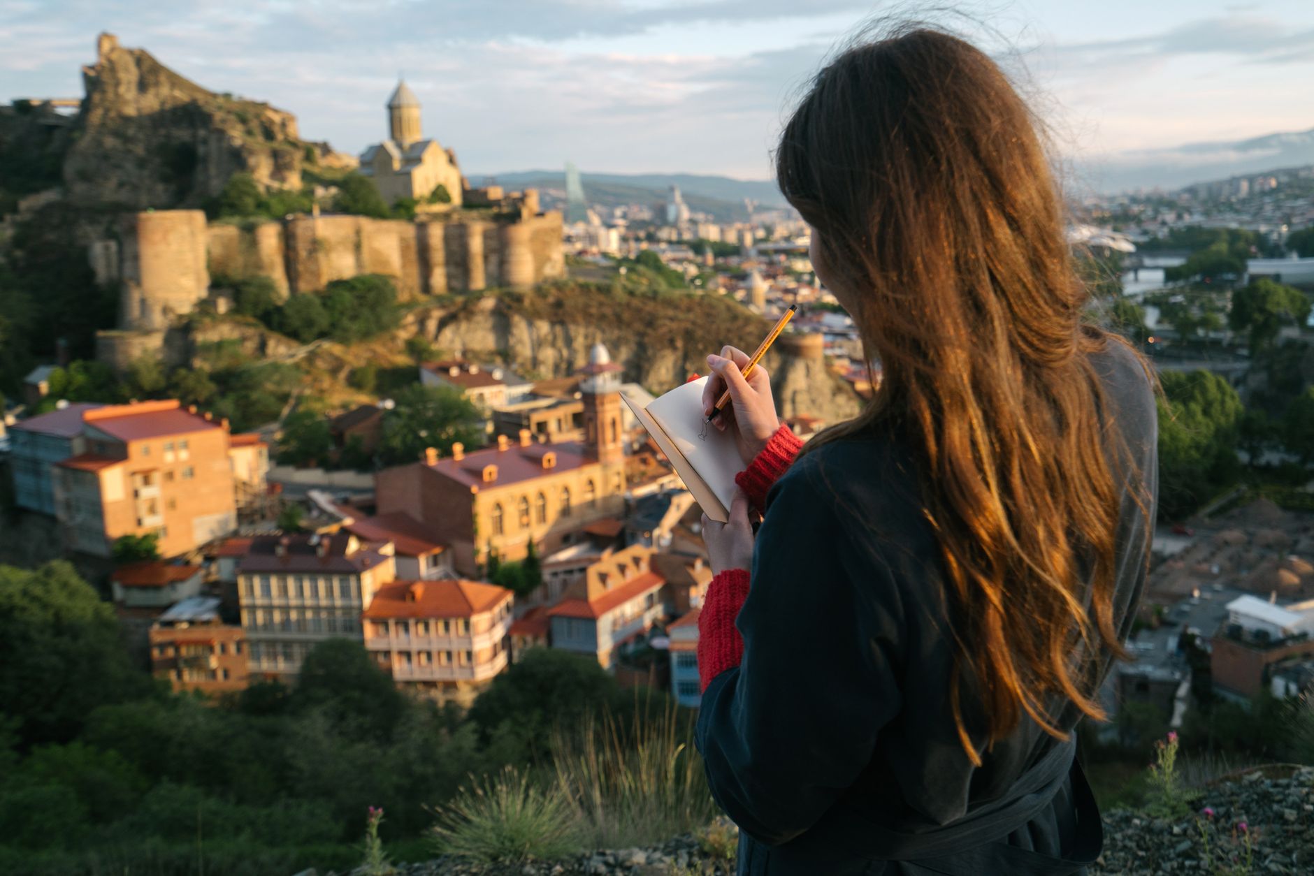 Travel author working in open air terrace
