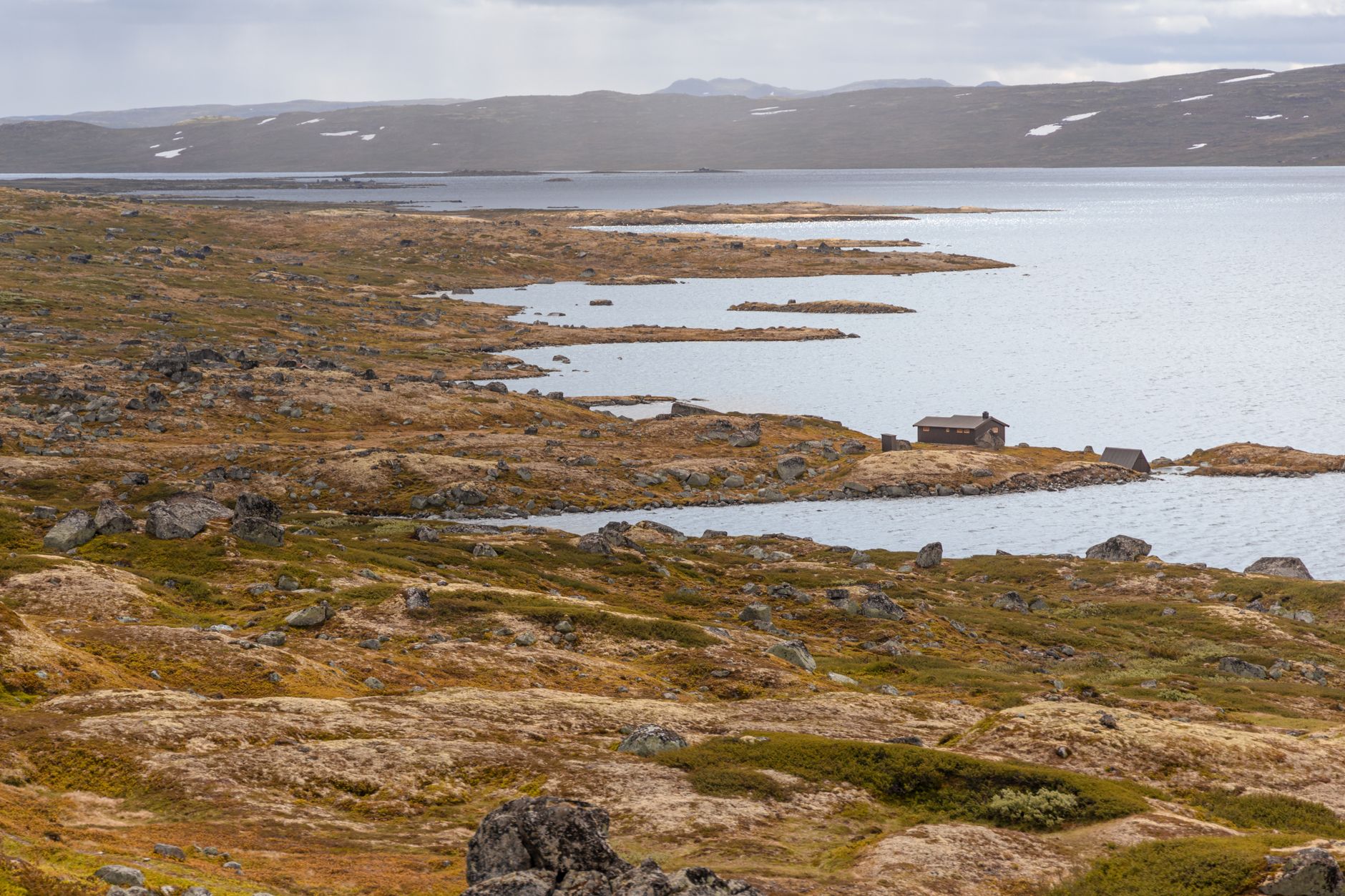Scandinavian fjord calm waters and timber refuge